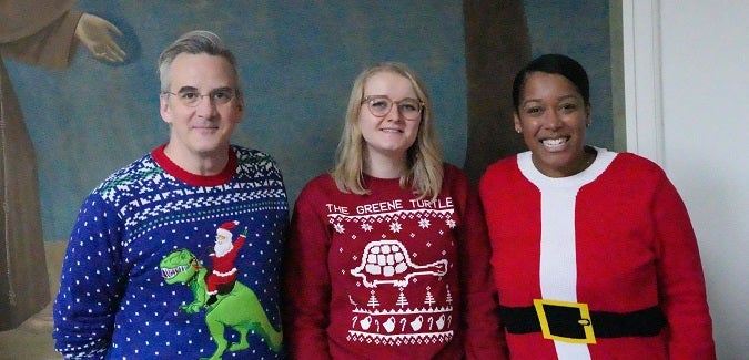 Pitt staff members at a holiday sweater party